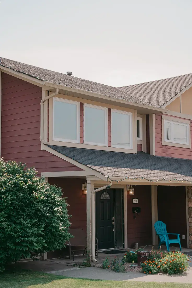 New windows installed on BC home with red wood siding